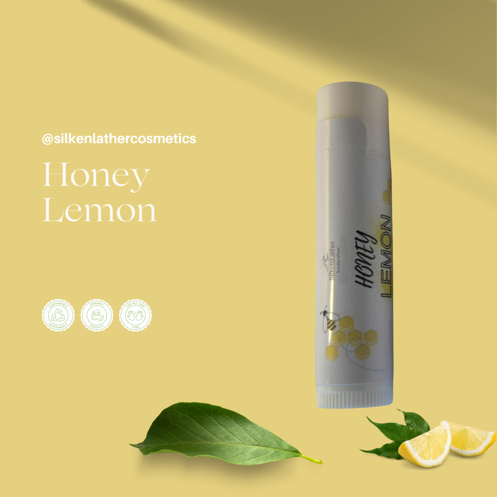 Three jars of Silken Lather Cosmetics natural lip butters with shea, mango, and kokum butters displayed on a wooden surface