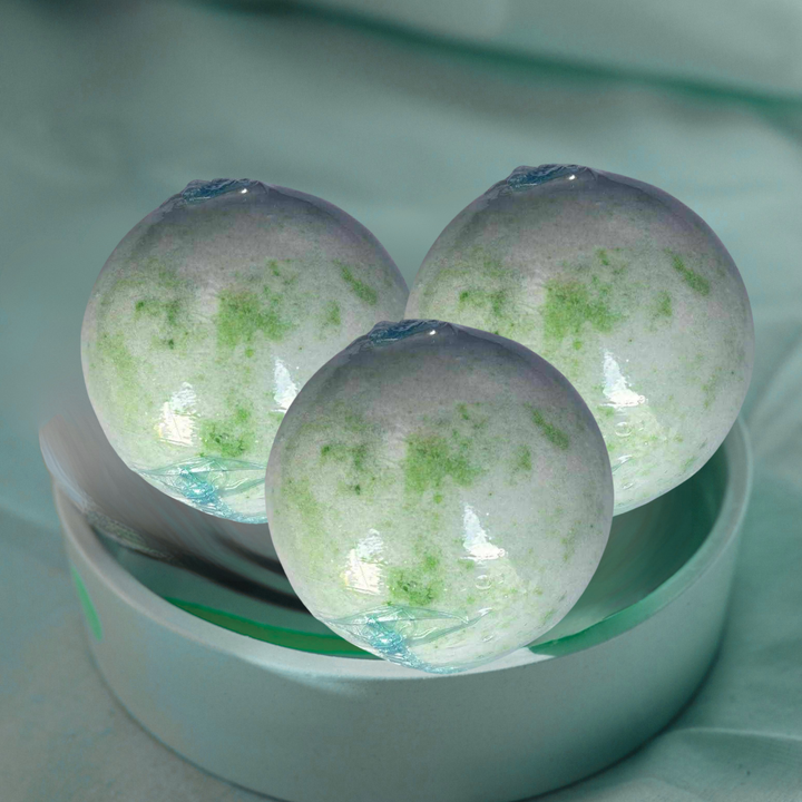 Coconut Lime Verbena Bath Ball 150g with tropical coconut, lime, and verbena scent for refreshing spa experience.