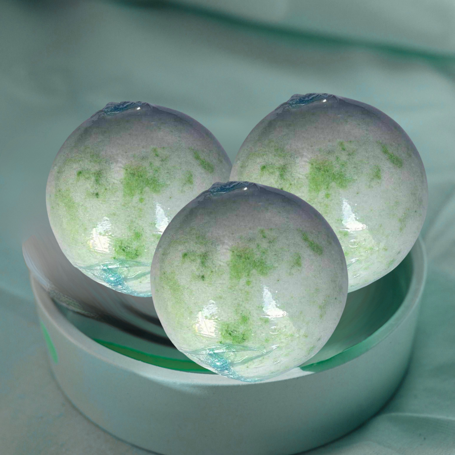 Coconut Lime Verbena Bath Ball 150g with tropical coconut, lime, and verbena scent for refreshing spa experience.