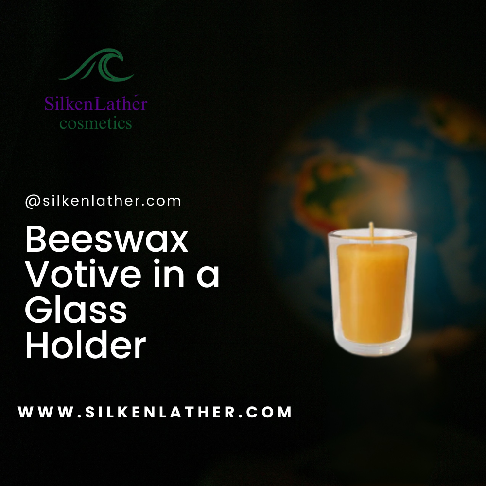 Beeswax votive candle in glass holder with warm golden flame and natural honey scent